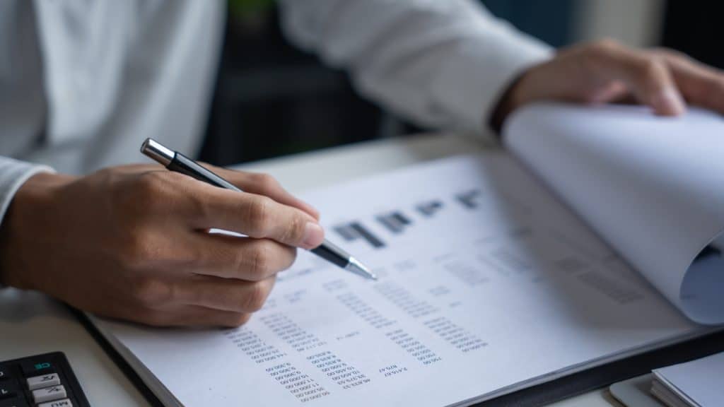Forensic accounting professional reviewing financial documents for litigation support.