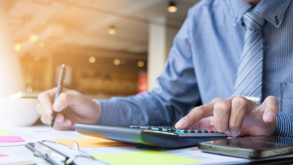 Forensic accountant analyzing financial documents for missing money cases.